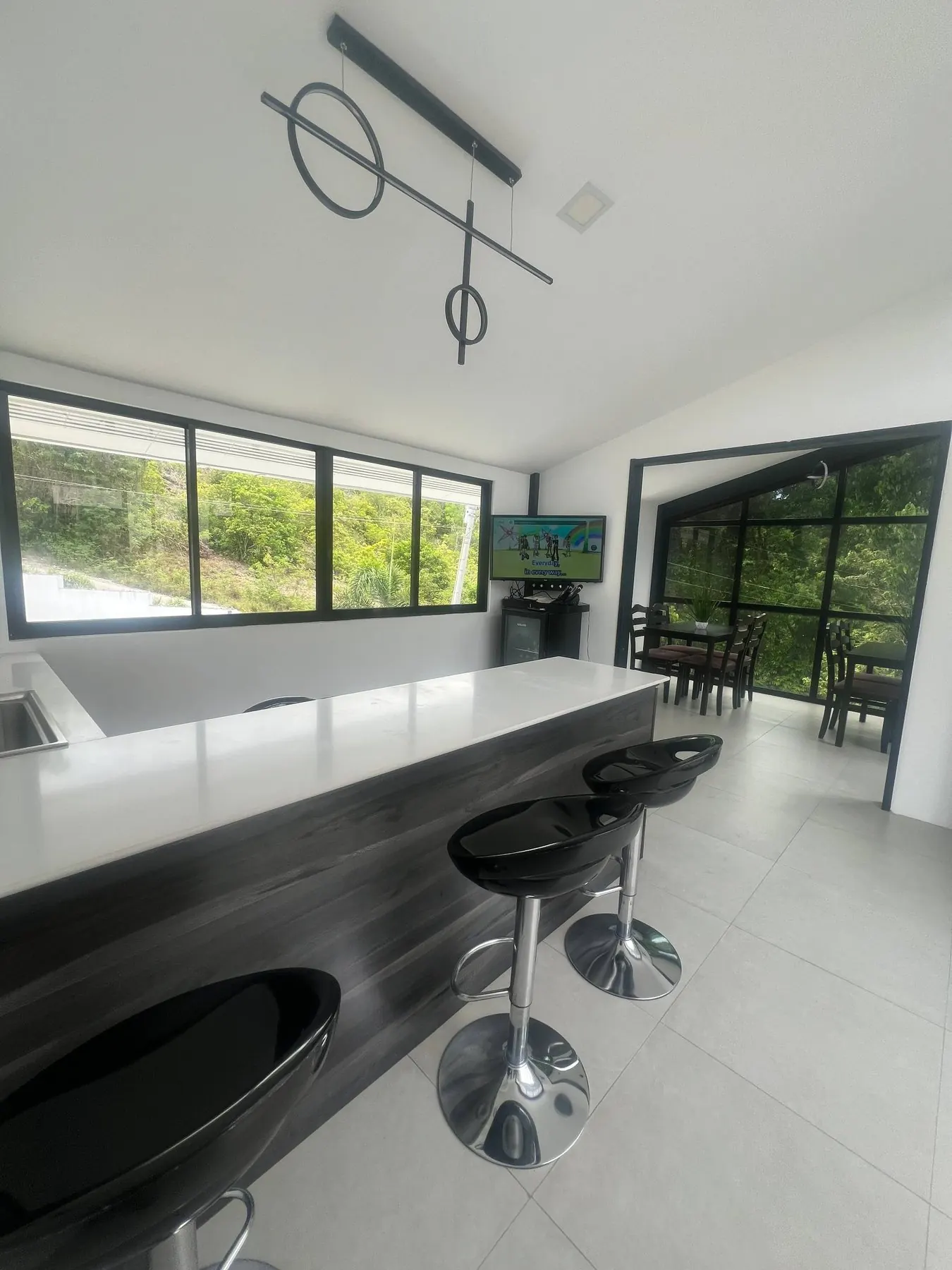 Bar and kitchen island beside the karaoke lounge