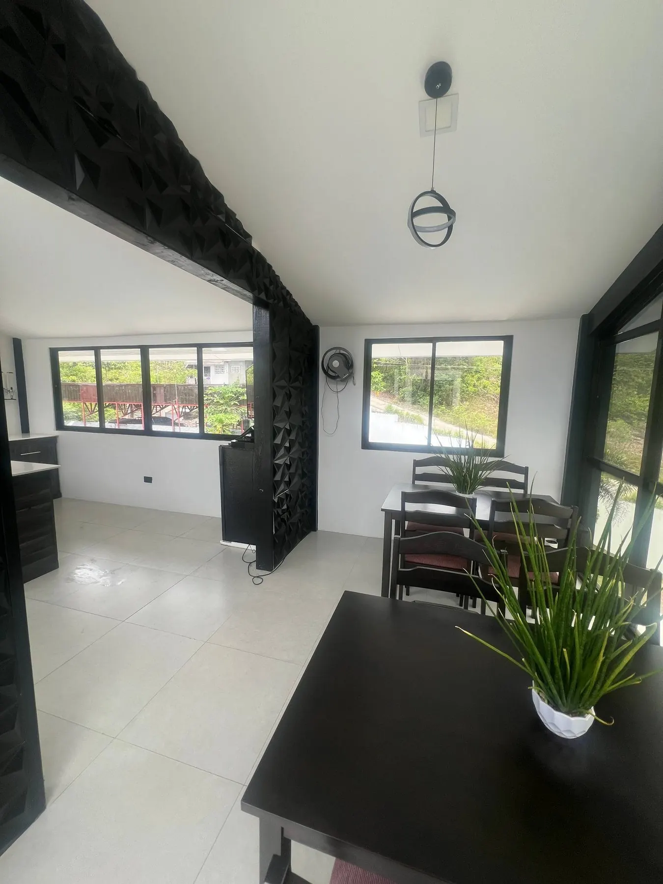 Dining and bar area with feature wall