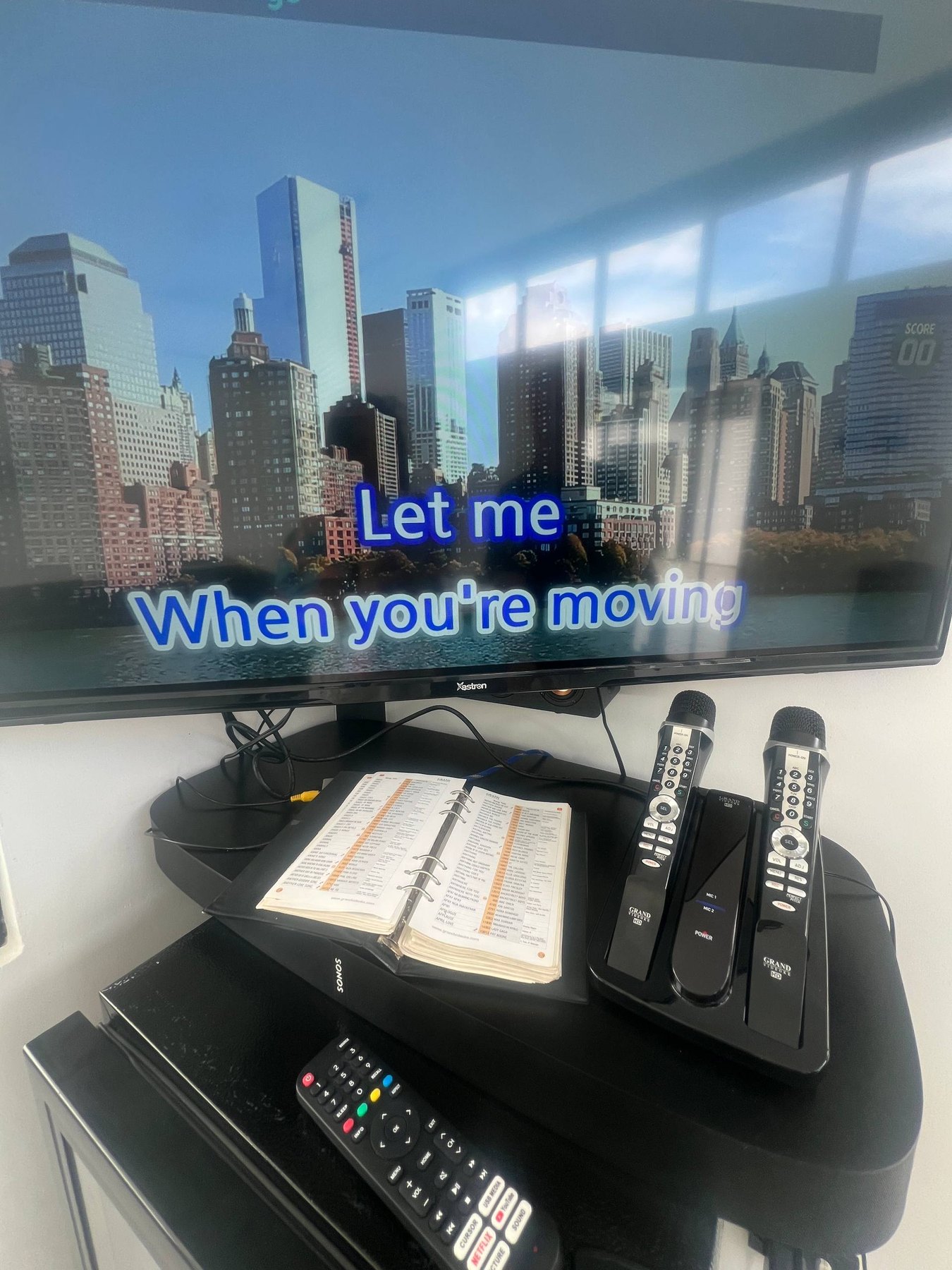 Grand Videoke karaoke machine and microphones