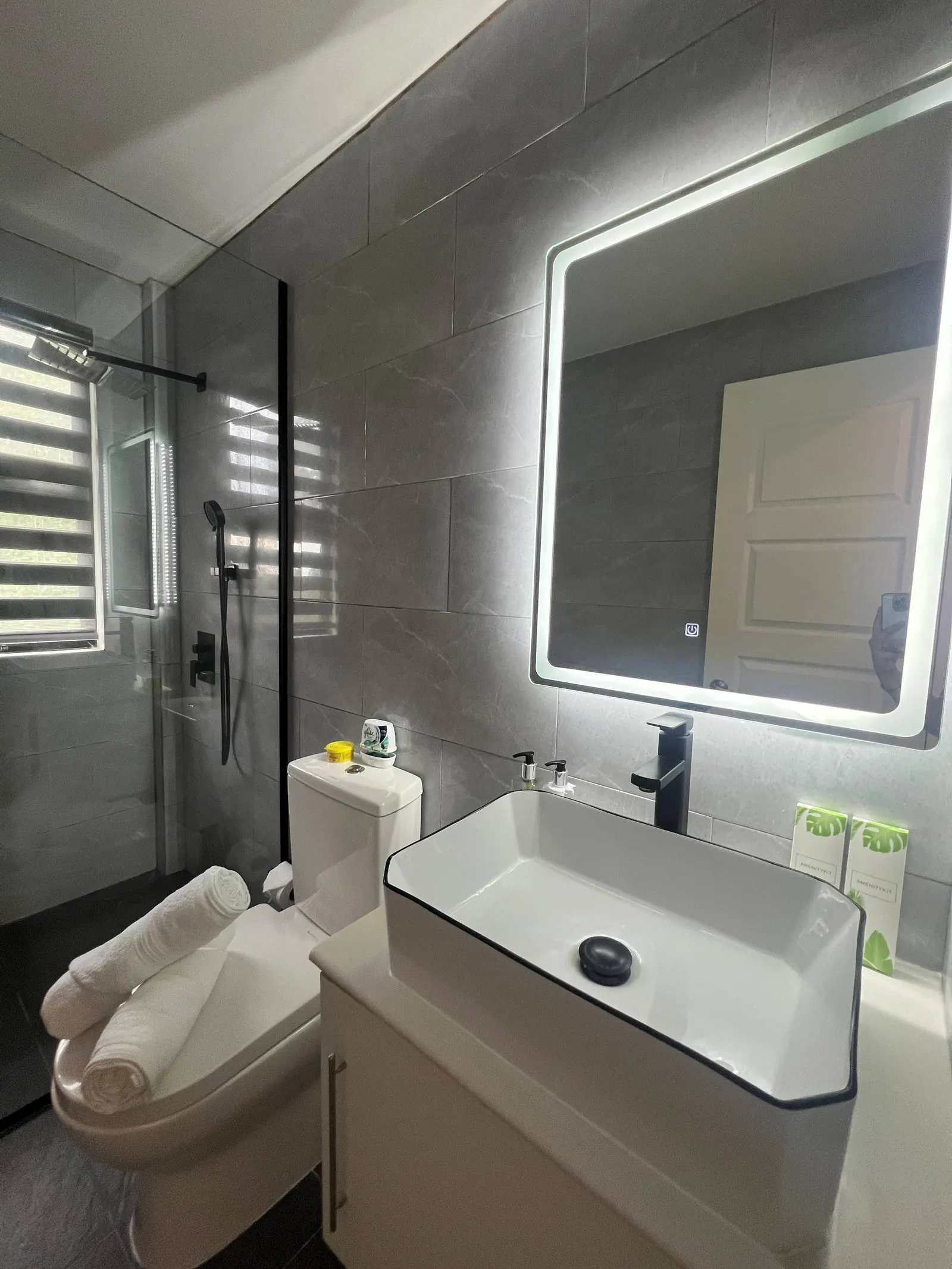 En-suite vanity, vessel sink, LED mirror and toilet
