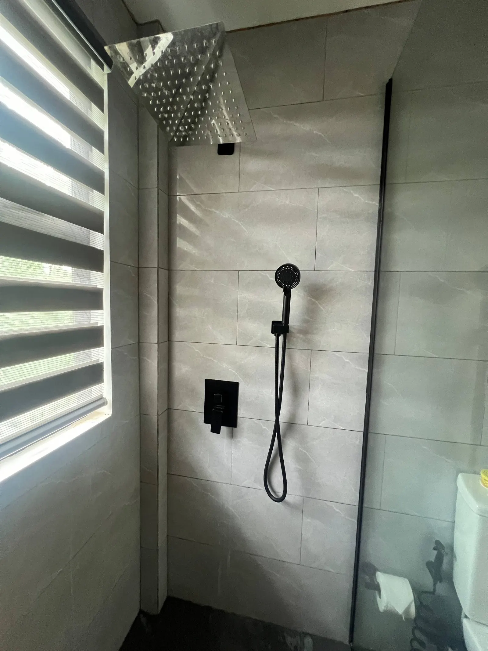 En-suite shower details with rain head, handheld and window