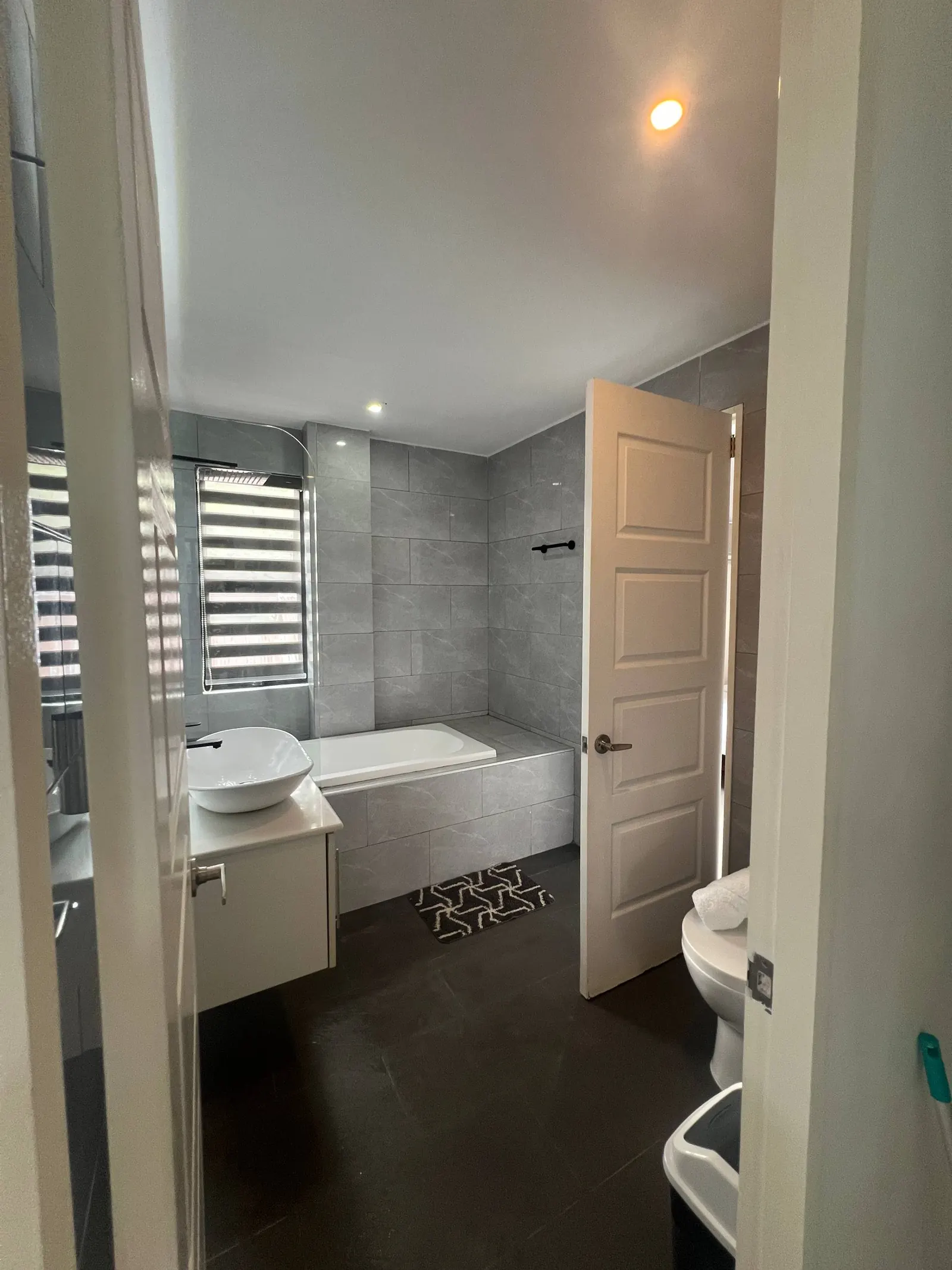 En-suite bathtub and shower partition view from doorway