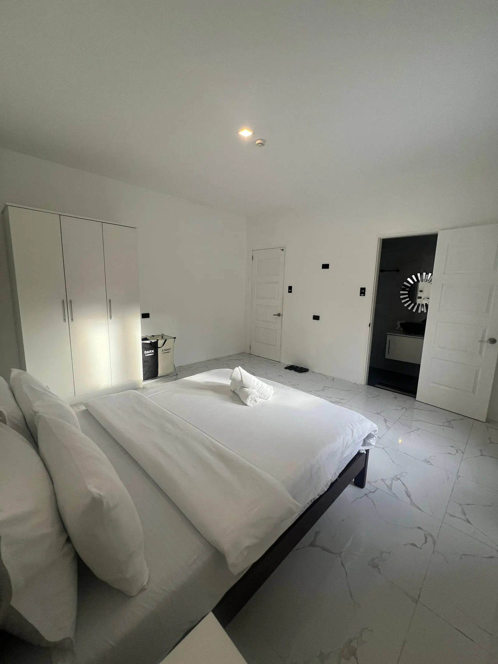 Bedroom 5 en-suite doorway visible with dark tiles