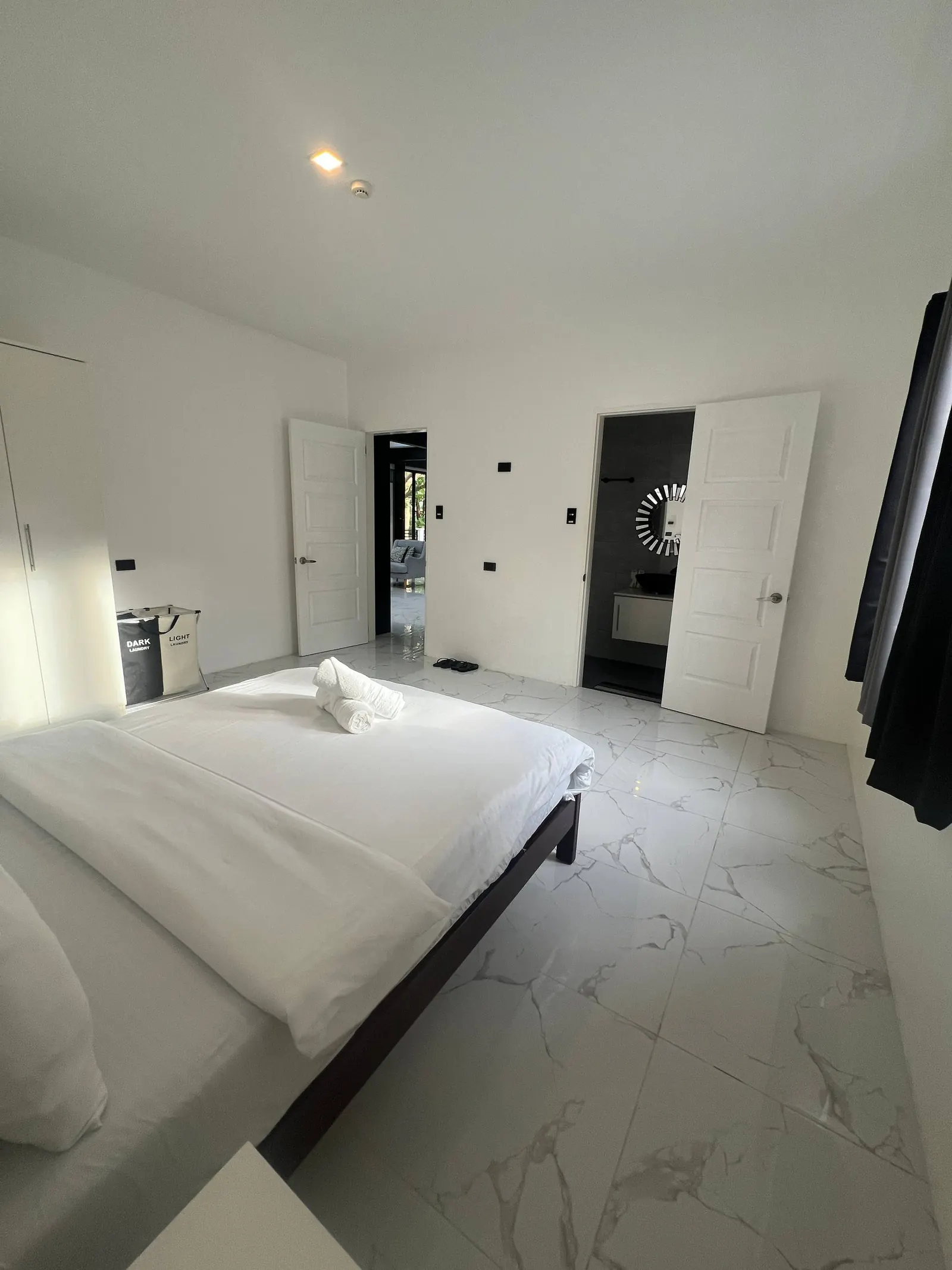 Bedroom 5 open doors showing living area and en-suite