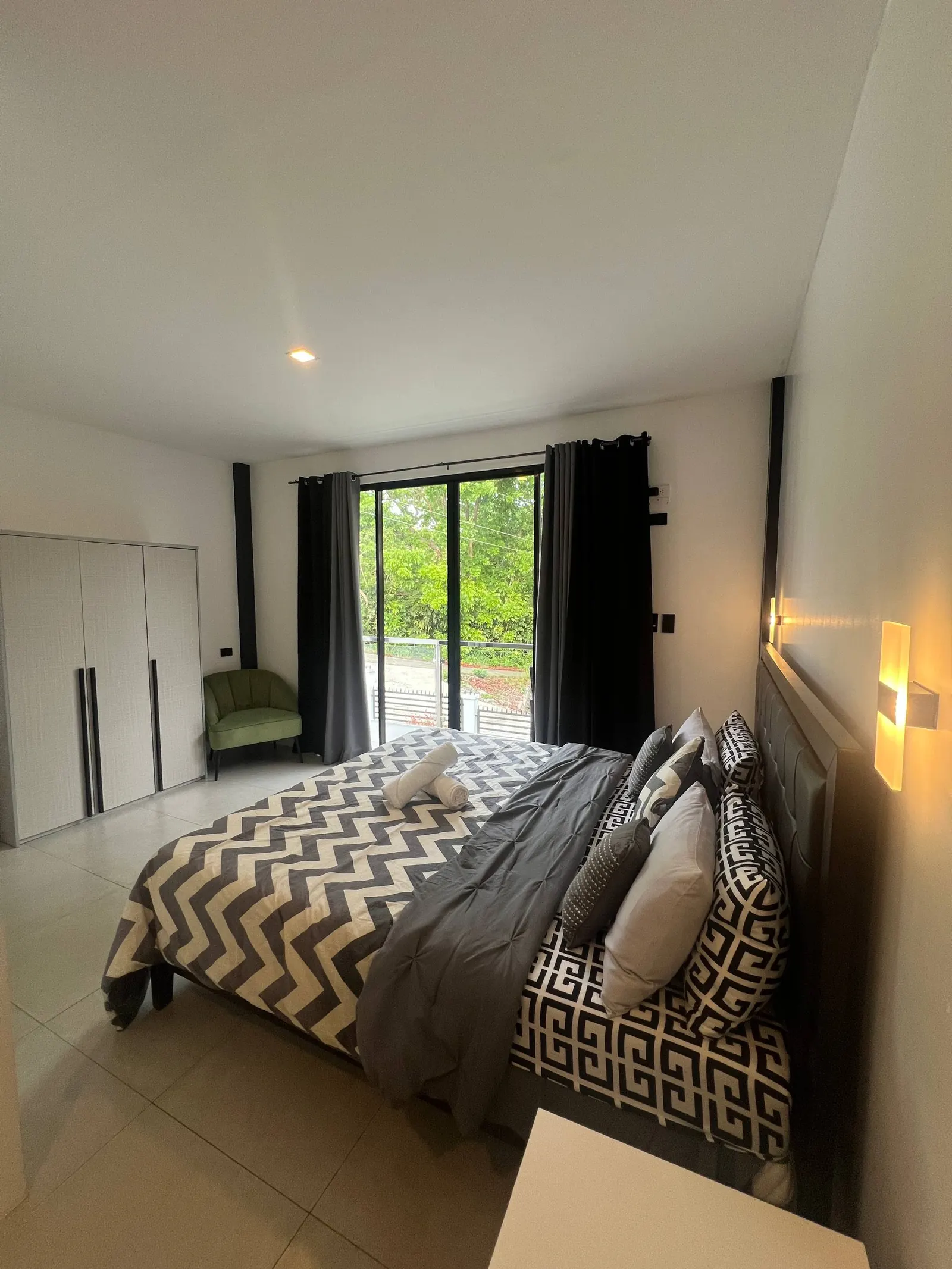 Master bedroom balcony doors and garden view