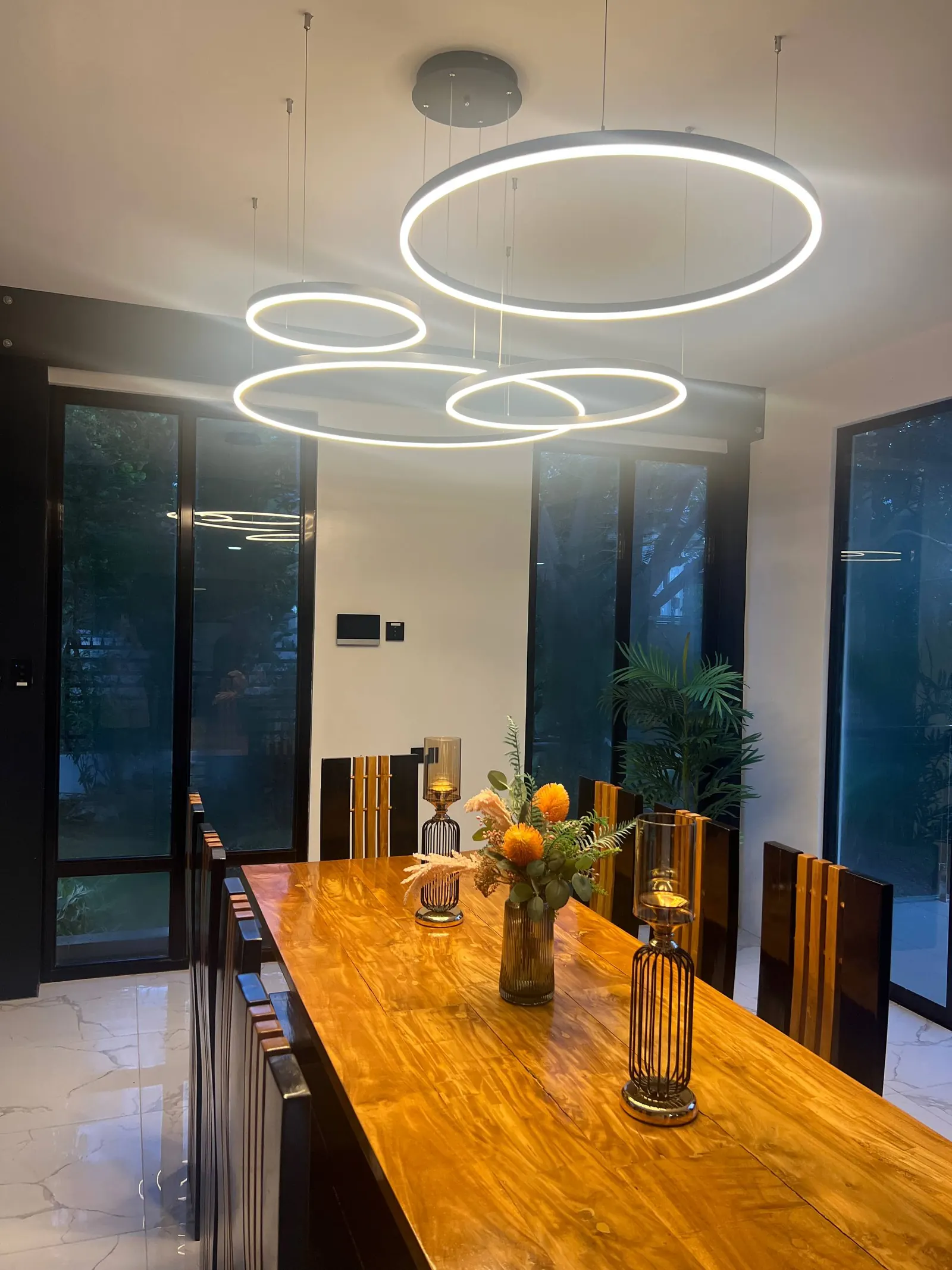 Dining area with candle holders and warm lighting