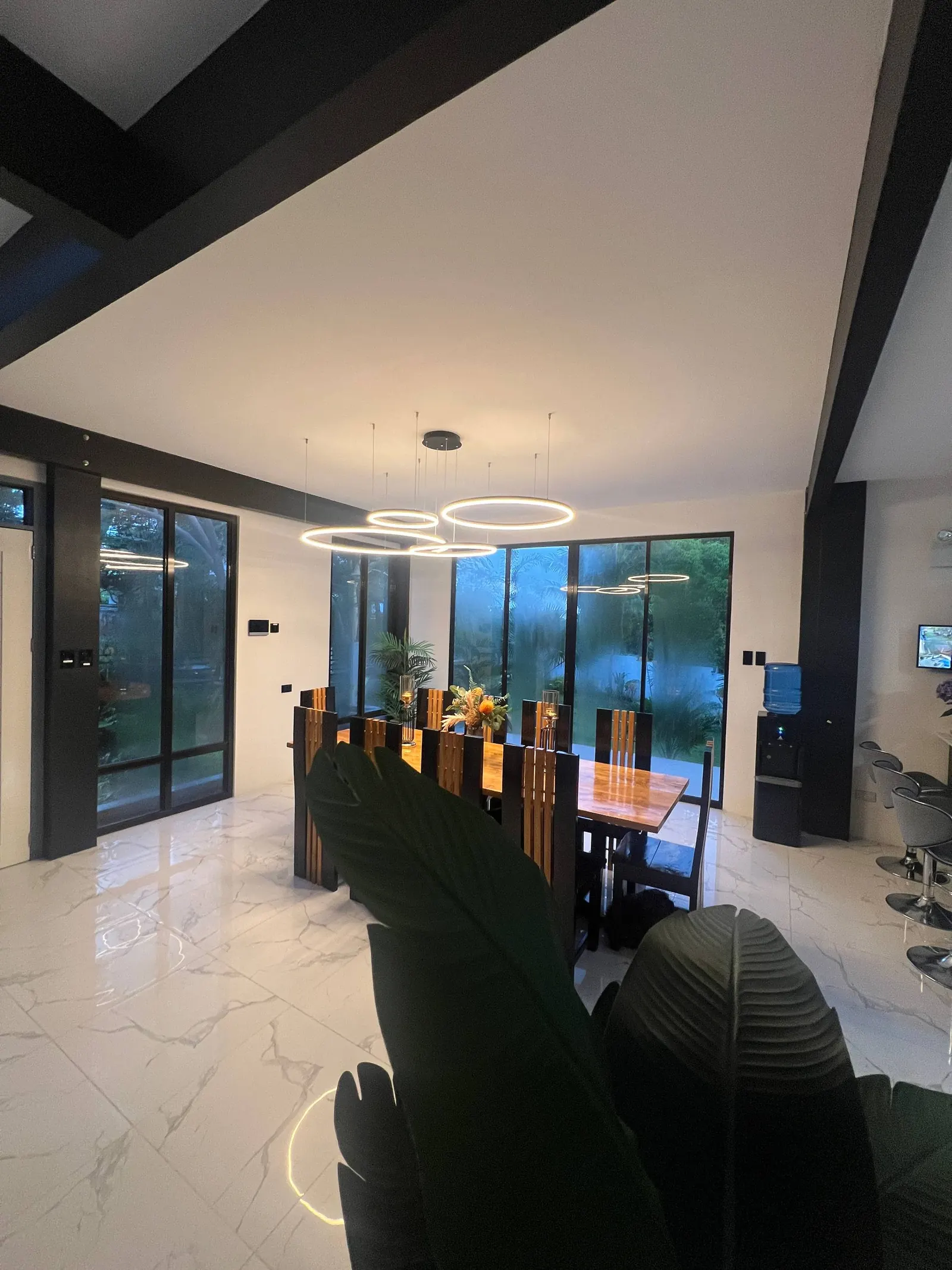 Open-plan dining and kitchen with bar stools
