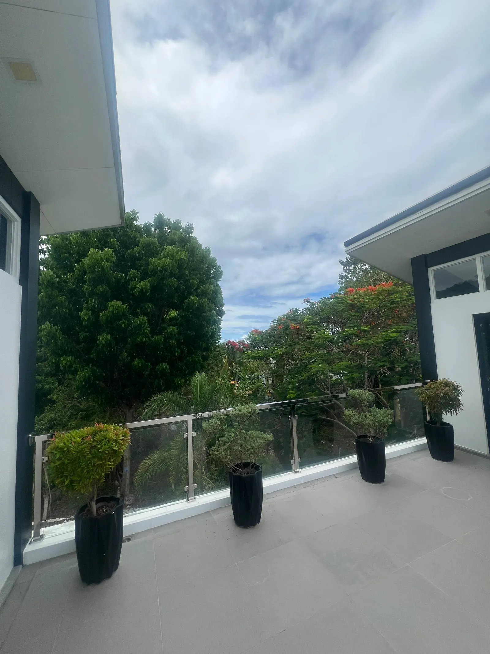 Outdoor balcony planters and glass railing